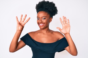 Young african american woman wearing casual clothes showing and pointing up with fingers number...