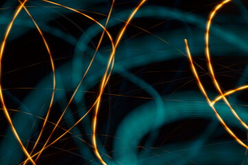 Water threads on black background - abstract graphic background showing azure irregular lines and chaotic ribbons.