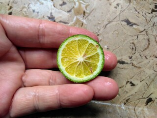 hand holding lemon