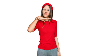 Young brunette woman wearing casual clothes cutting throat with hand as knife, threaten aggression...