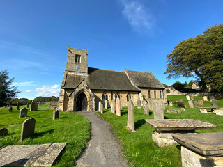 Fototapeta na wymiar An old church on, Stang Lane, set against a vivid blue sky in, Farnham, Harrogate, UK