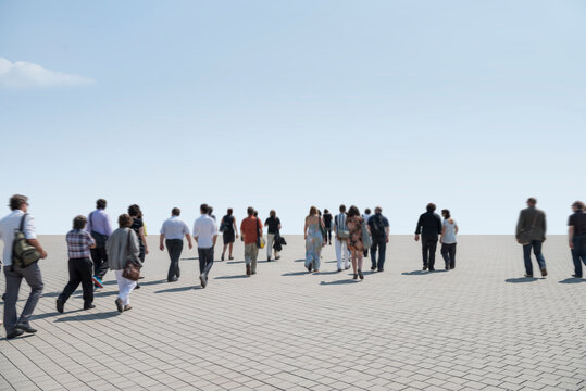 Group Of People Walking On The Road