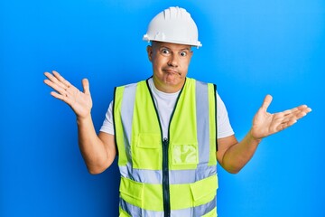 Middle age bald man wearing architect hardhat clueless and confused with open arms, no idea and doubtful face.
