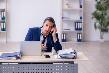 Sick male employee suffering at workplace
