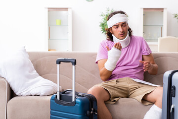 Young injured man preparing for the trip