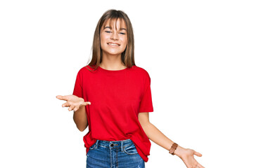 Teenager caucasian girl wearing casual red t shirt smiling cheerful with open arms as friendly welcome, positive and confident greetings