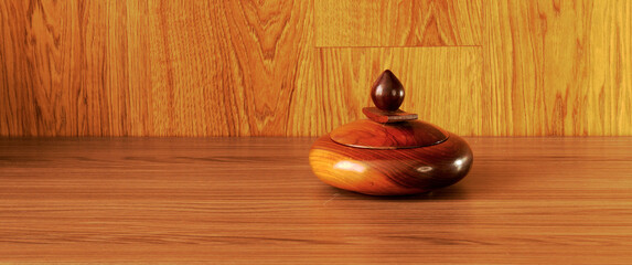 Cedar sugar bowl in wood table