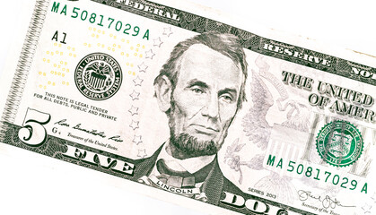 Dollar ( USD ). Money of United States of America. Five dollar bill in close-up with white...