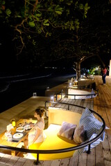 Female tourist enjoying food, wine and sea view at Khanom, thailand
