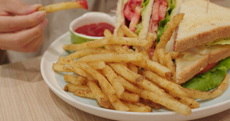 Sandwich and french fires in restaurant