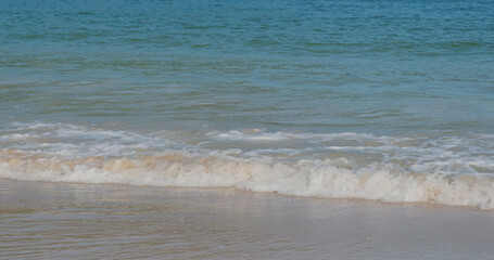 Sea wave over the sand beach