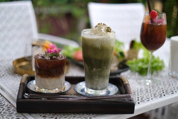 coffee latte 
Iced green tea in a glass on the table