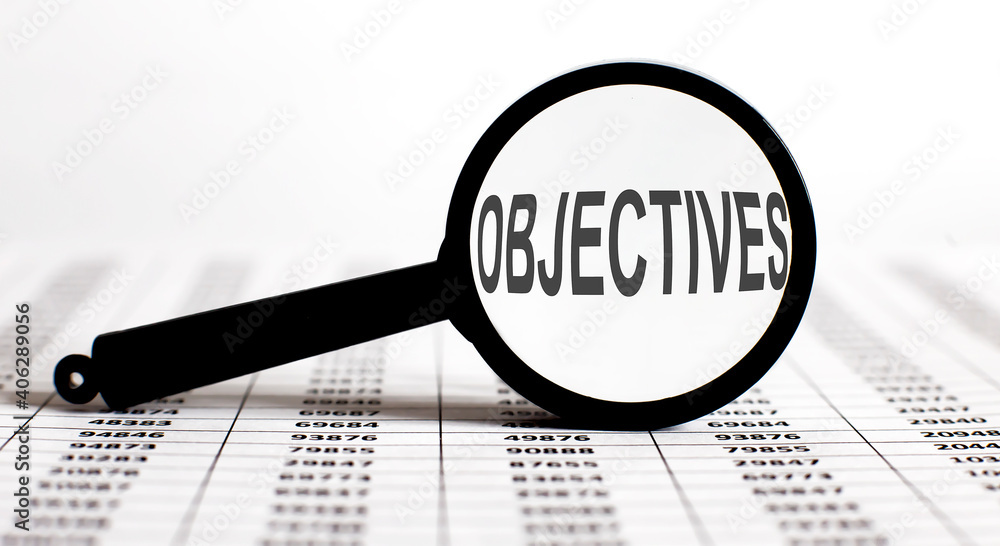 Poster magnifying glass with text objectives on the chart