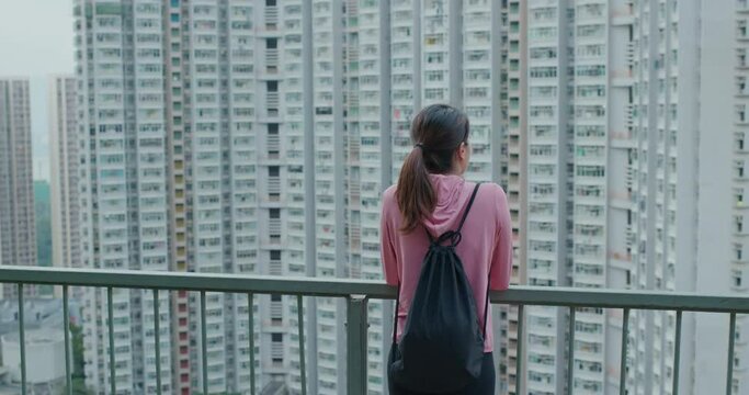 Woman look at the compact building
