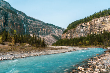 Glacial turquoise river with mountains