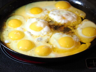 chicken eggs in a pan in oil fried