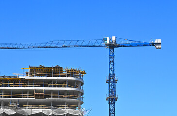 Crane and highrise construction site