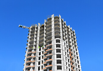 Crane and highrise construction site