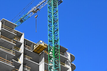 Crane and highrise construction site