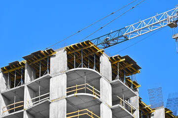 Crane and highrise construction site