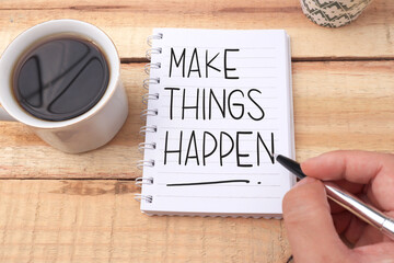 Make things happen, text words typography written on book against wooden background, life and business motivational inspirational