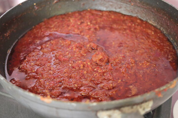 Indonesian fried hot spicy chilli sauce, or also known as sambal goreng, mixed of chilli, onion, shallot, garlic and tomato