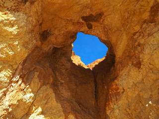 Praia da Vau with a cave with a hole to the sky in Portimao at the Algarve coast of Portugal