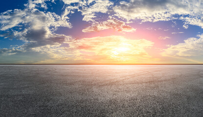 Asphalt race track road and sky clouds at sunset.Road ground background.