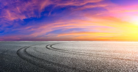 Keuken spatwand met foto Asphalt race track road and sky clouds at sunset.Road ground background. © ABCDstock