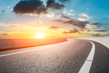 Asphalt road and sky clouds at sunset.Road background.
