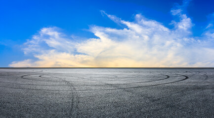 Asphalt race track road and sky clouds at sunset.Road ground background.