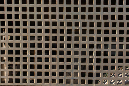 Closeup of the square holes perforated meshbackground