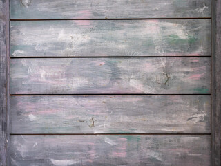 Wooden background from wooden planks painted in white and blue tones with a pinkish tint