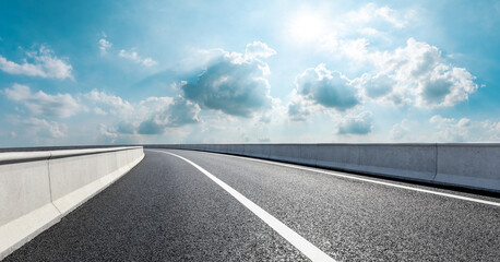 Empty asphalt road and blue sky with white clouds.Road background.