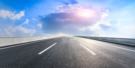 Empty asphalt road and blue sky with white clouds.Road background.