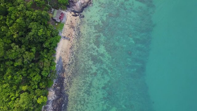 Lonely, rocky beach and corals on Tioman Island (Malaysia)