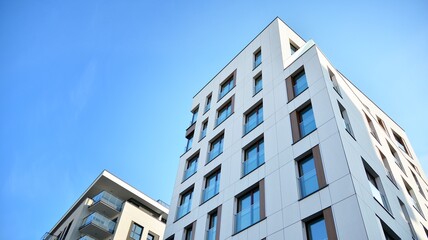 Fragment of modern luxury residential apartment,  home house building concept. Modern apartment building on a sunny day with a blue sky.