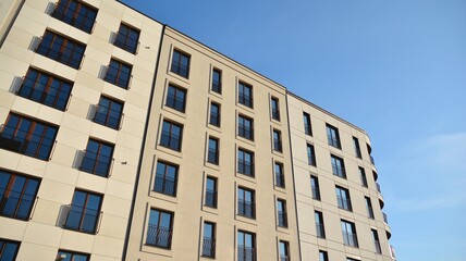 Fragment of modern luxury residential apartment,  home house building concept. Modern apartment building on a sunny day with a blue sky.