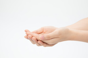 Closeup shot of hands in a begging gesture isolated on a white background