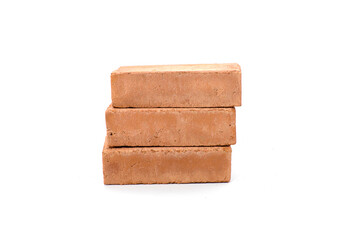 Red bricks isolated on white background. Solid clay bricks used for construction.