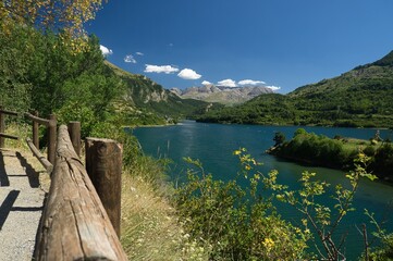 views of the town of Lanuza from the viewpoint. Large lake with mountains in the background.