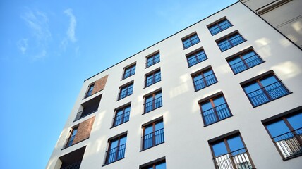 Fragment of modern luxury residential apartment,  home house building concept. Modern apartment building on a sunny day with a blue sky.