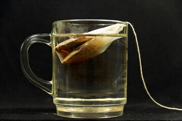 The process of brewing tea bags.