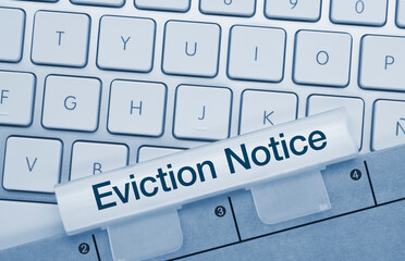 Eviction Notice - Inscription on Blue Keyboard Key.