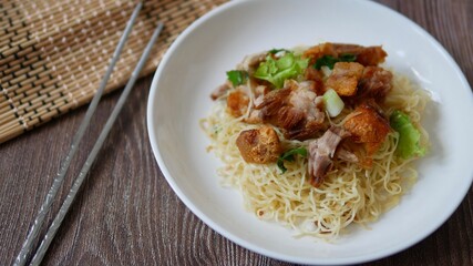 Chinese egg noodles with crispy pork