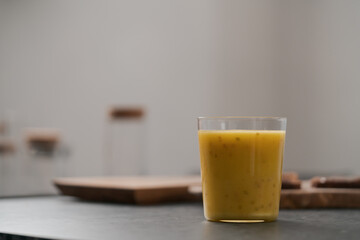 Fresh mango lulo smoothie on kitchen countertop