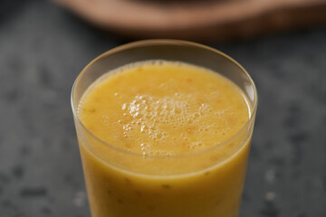 Fresh mango lulo smoothie on kitchen countertop