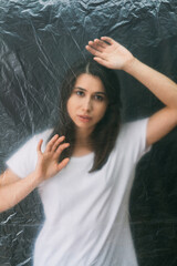 Female loneliness. Defocused portrait. Misery tragedy. Regret sorrow. Desperate sad woman trapped...