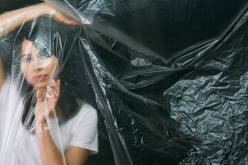 Female loneliness. Defocused portrait. Freedom protection. Disappointed hopeless woman trapped in...