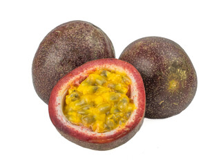 Whole passion fruit and a half maracuya fruit (Passiflora edulis) isolated on white background